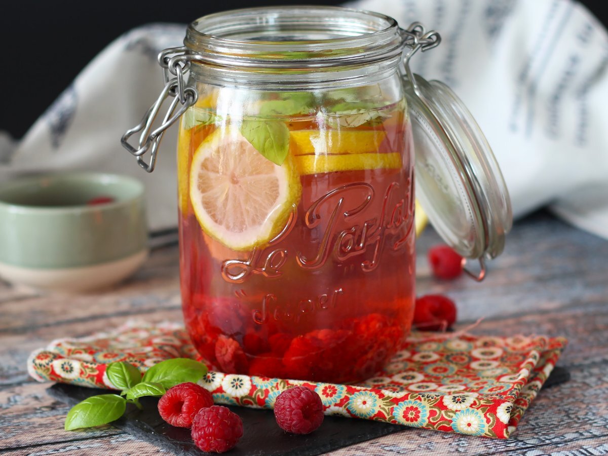 Homemade flavored water with lemon, basil and raspberry - photo 3