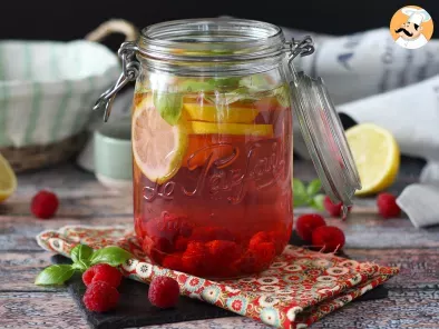 Homemade flavored water with lemon, basil and raspberry