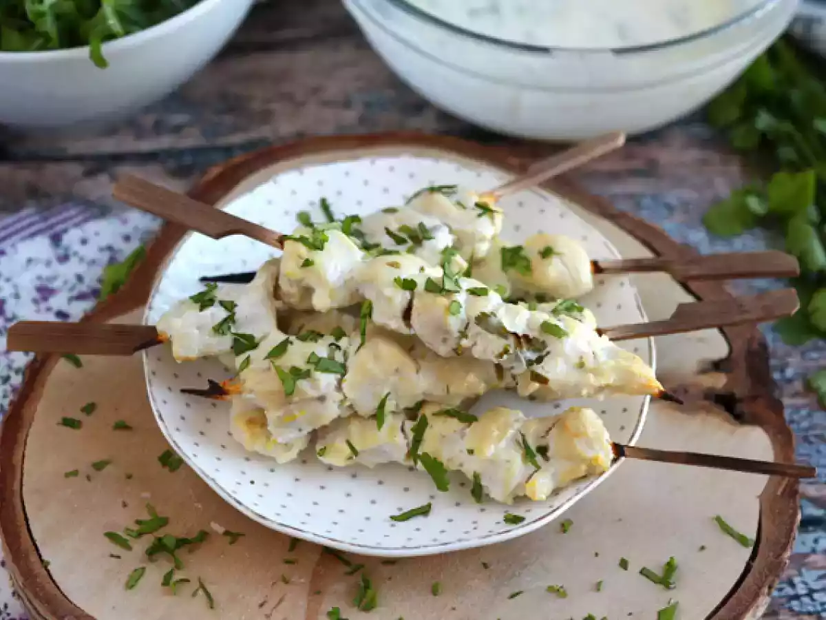Marinated chicken skewers in yogurt lemon sauce
