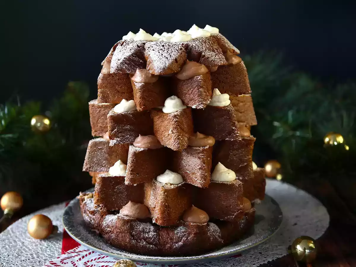 Pandoro brioche filled with nutella cream and vanilla cream in the shape of a christmas tree