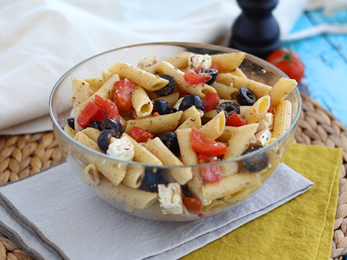 Pasta salad, with tomato, feta cheese and olives