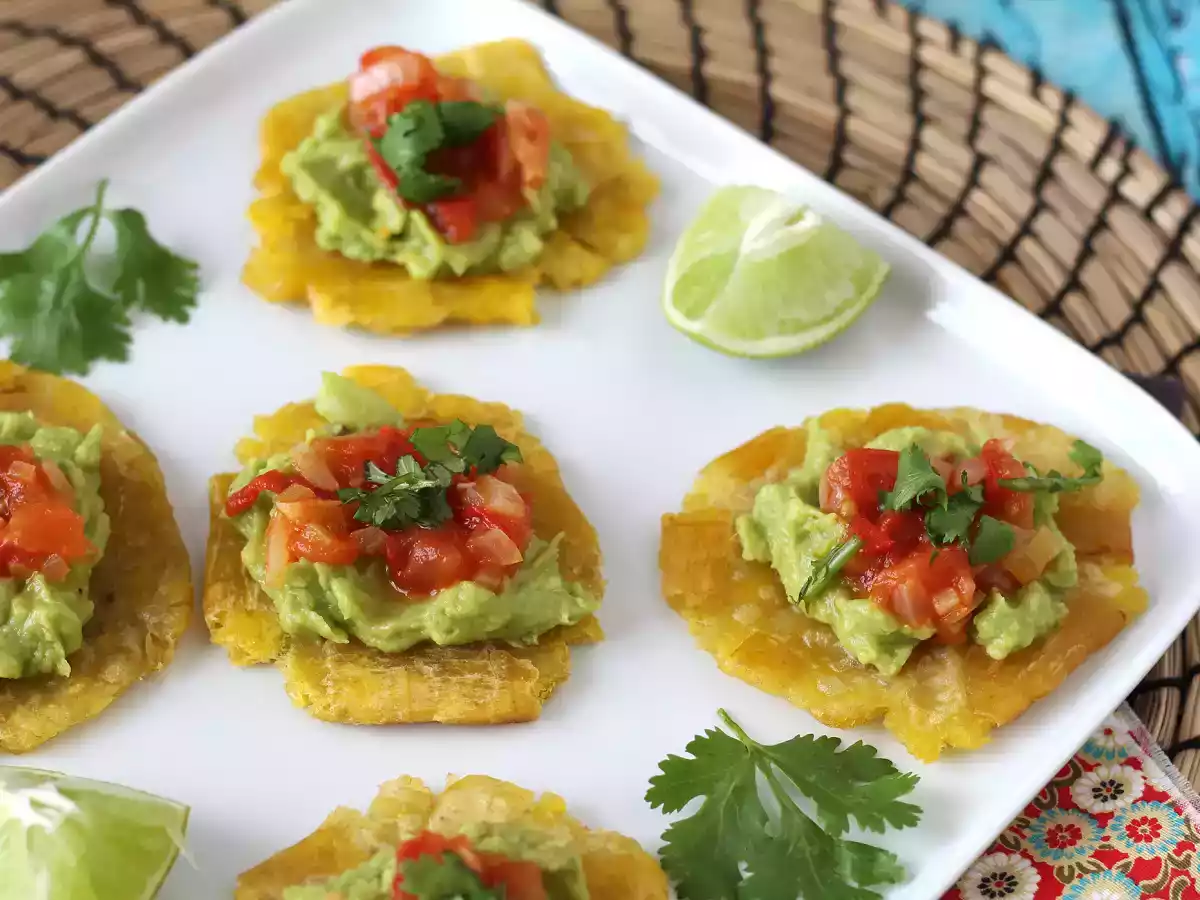 Patacones, colombian plantain toast with guacamole and tomatoes