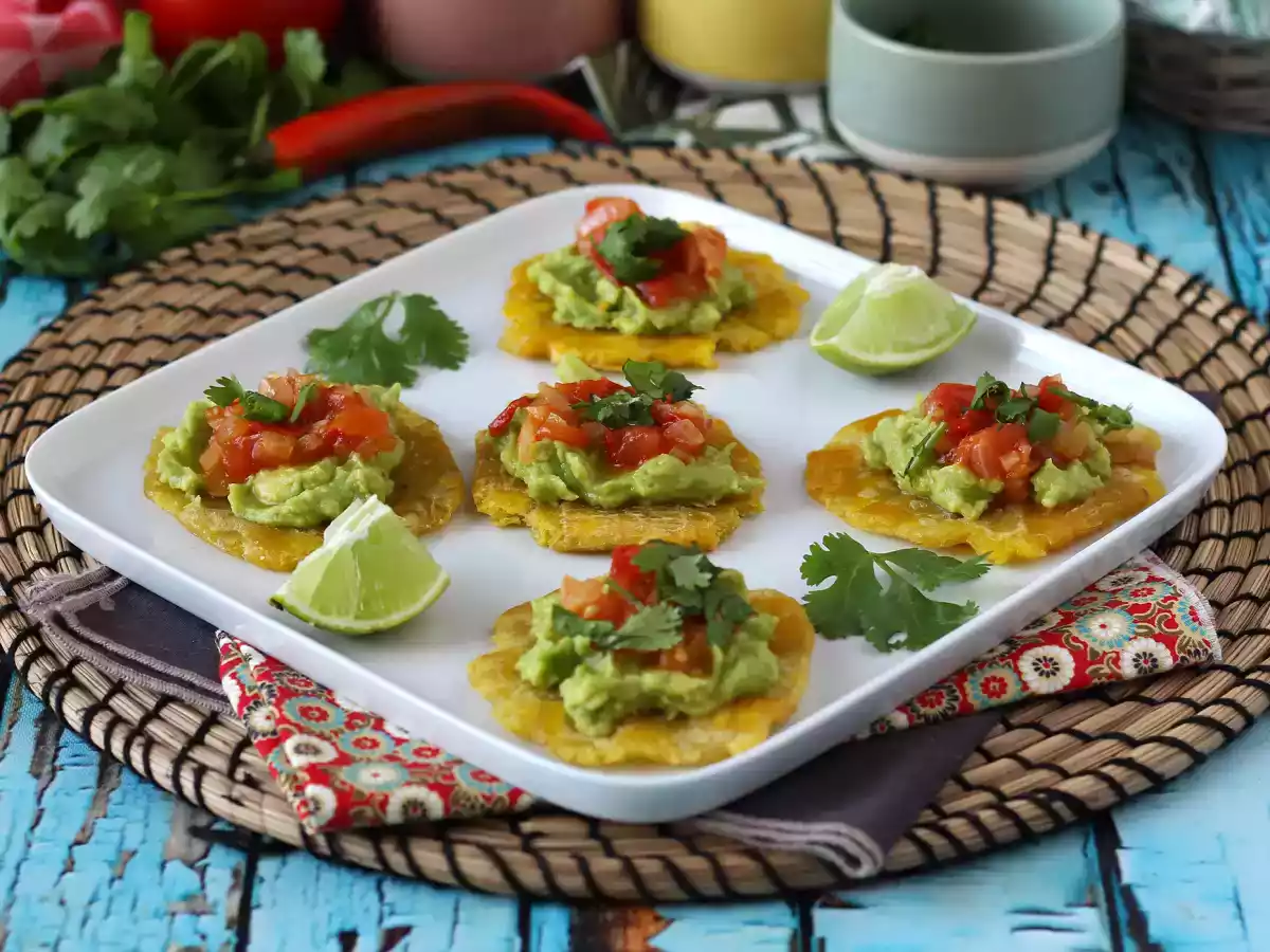 Patacones, colombian plantain toast with guacamole and tomatoes - photo 2