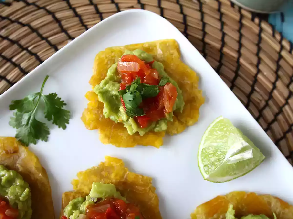 Patacones, colombian plantain toast with guacamole and tomatoes - photo 3