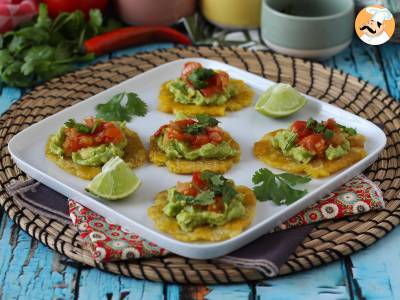 Patacones, Colombian plantain toast with guacamole and tomatoes - photo 2