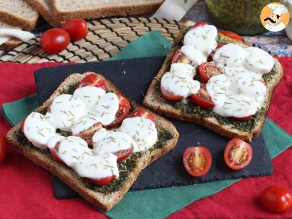 Pesto, cherry tomatoes and mozzarella bruschetta