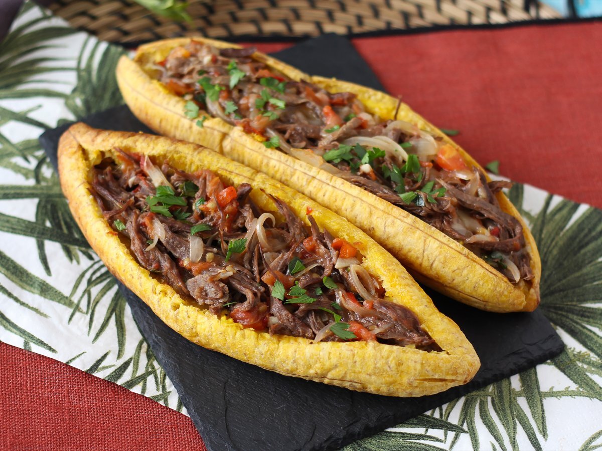 Plantains stuffed with shredded meat and grated cheese