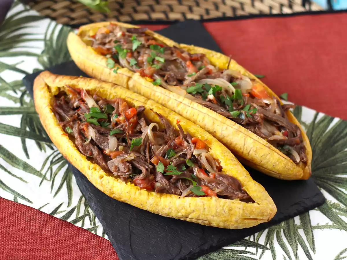 Plantains stuffed with shredded meat and grated cheese