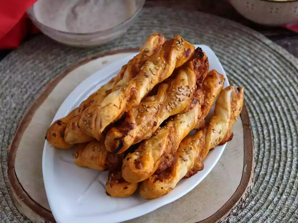 Puff pastry twists with red pesto and mozzarella