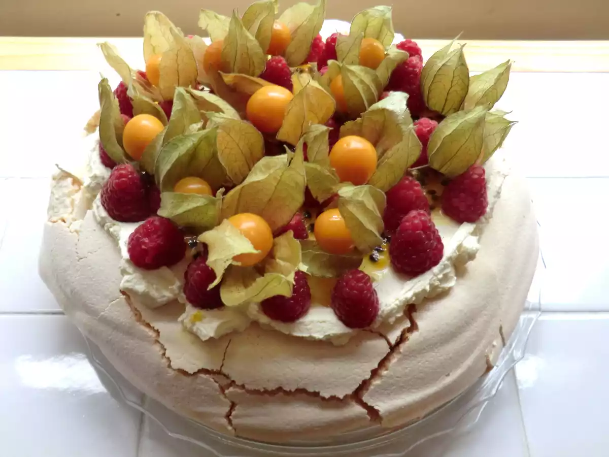 Raspberry and Physalis Pavlova with Passion Fruit Coulis