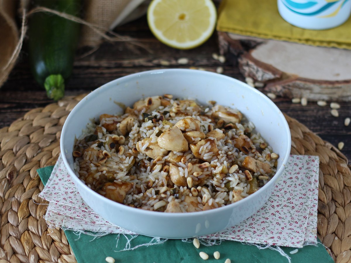 Rice salad with chicken, zucchini, pine nuts and balsamic vinegar