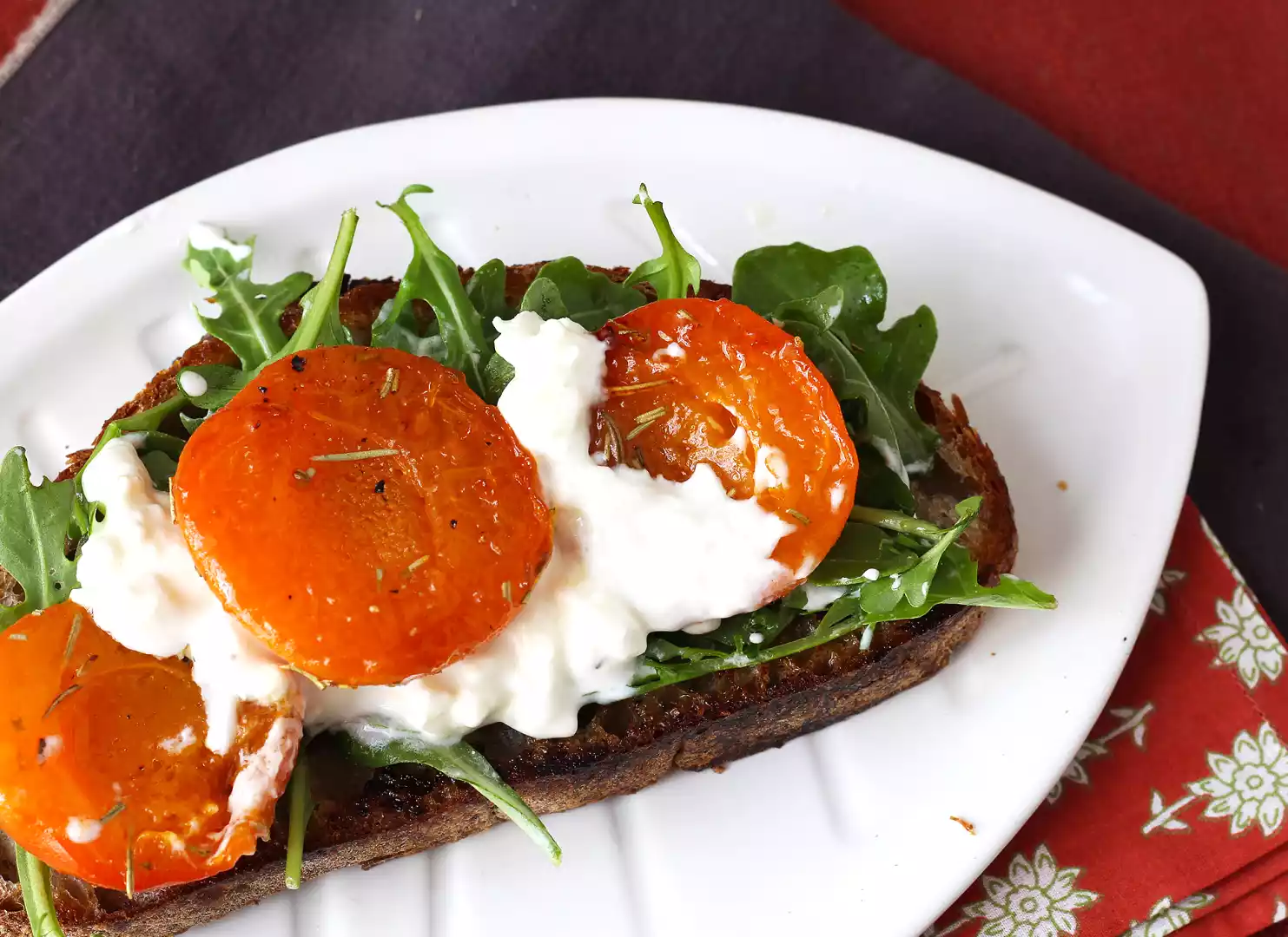 Roasted apricots, arugula and burrata on toast