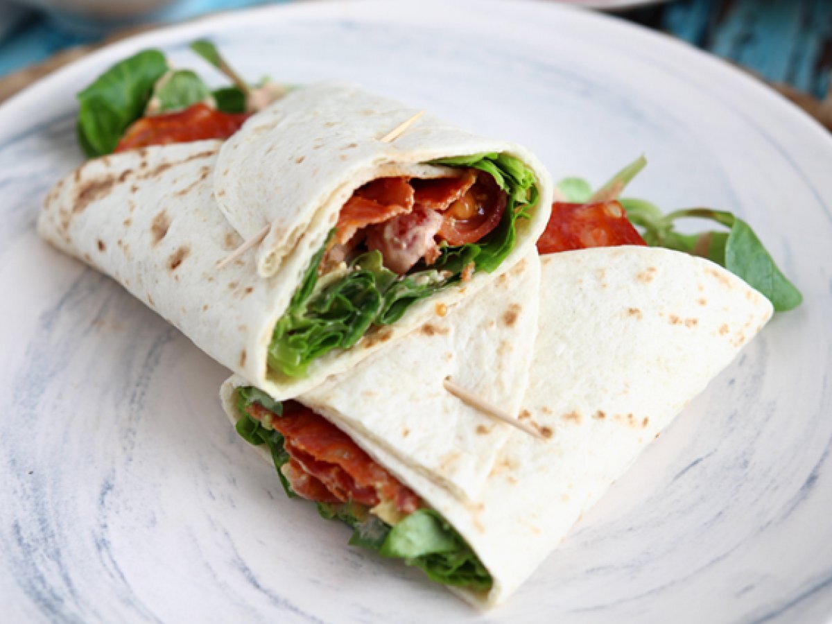 Sandwich wrap with chorizo, avocado and tomatoes