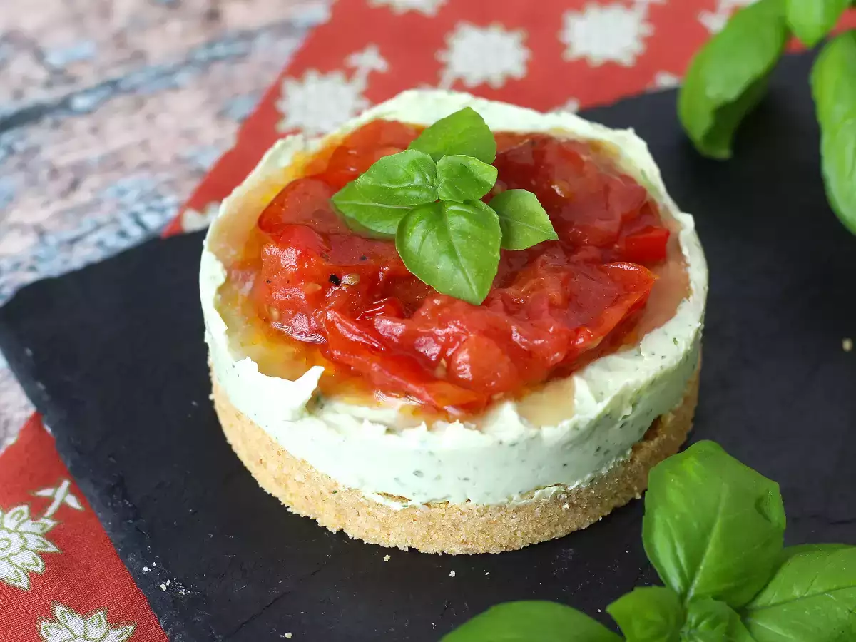 Savory cheesecake with basil and cherry tomatoes: tasty idea for buffets and appetizers