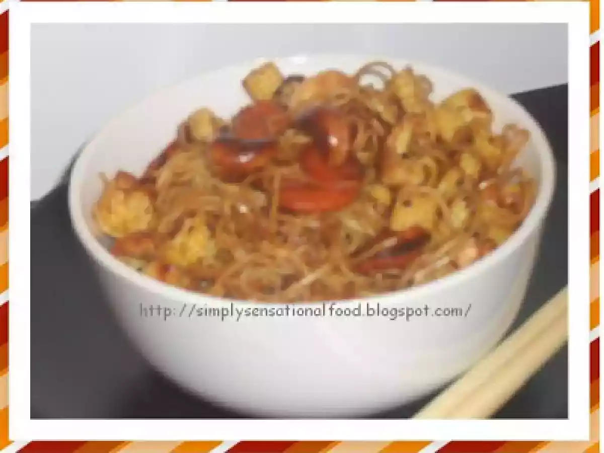 Stir fried noodles with baby corn and carrots.