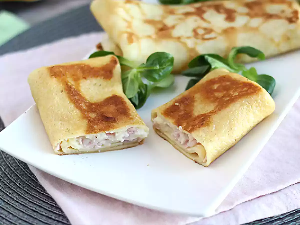 Stuffed crepes with béchamel sauce, cheese, and ham