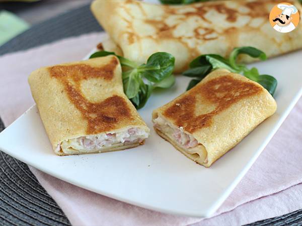 Stuffed crepes with béchamel sauce, cheese, and ham