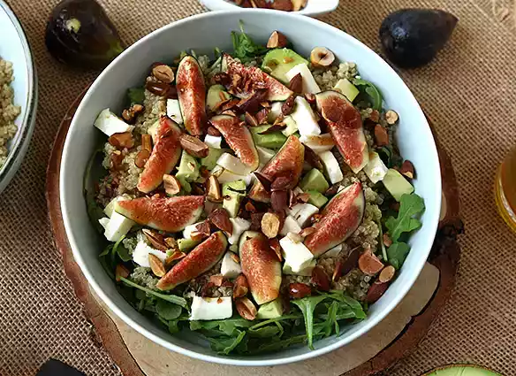 Sweet and savory fig, arugula, quinoa, mozzarella, and avocado salad