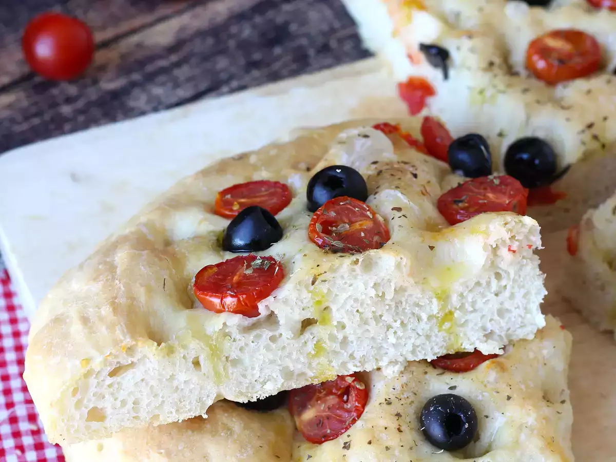 Thick, fluffy focaccia with cherry tomatoes, olives, and oregano - photo 5