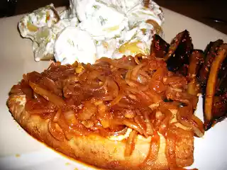 Tuna steak recipe with caramelized onions and sides